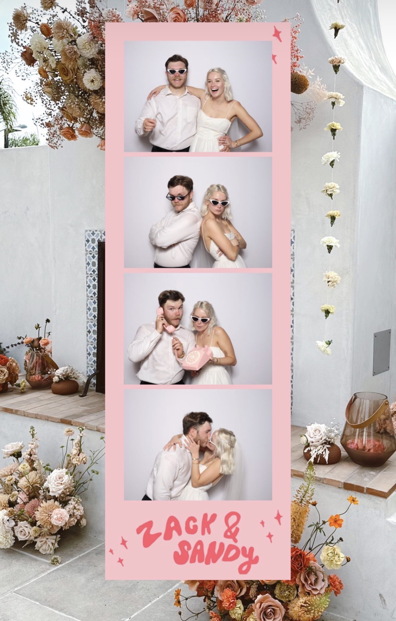 Wedding photobooth with floral backdrop
